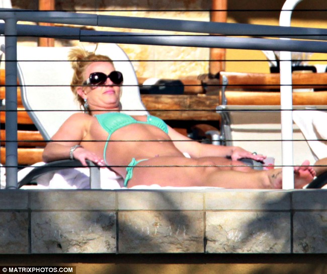 Time out Britney Spears relaxed poolside in Miami