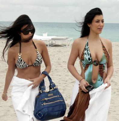 Kim Kardashian amp KourtneyHer Siste in Tiny Swimsuit Kourtney's zebra print